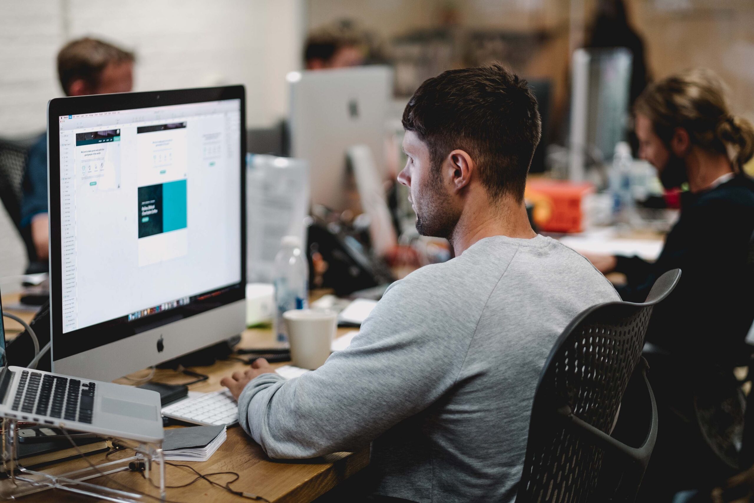 Man in office looking at monitor